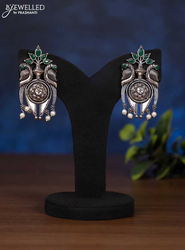 Oxidised earring with emerald stones and pearl hangings