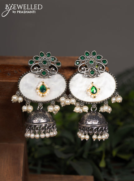 Oxidised jhumka with emerald stones and pearl hangings
