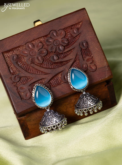 Oxidised jhumka with light blue stone and hangings