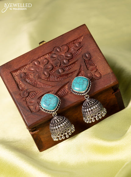 Oxidised jhumka with light blue stone and hangings