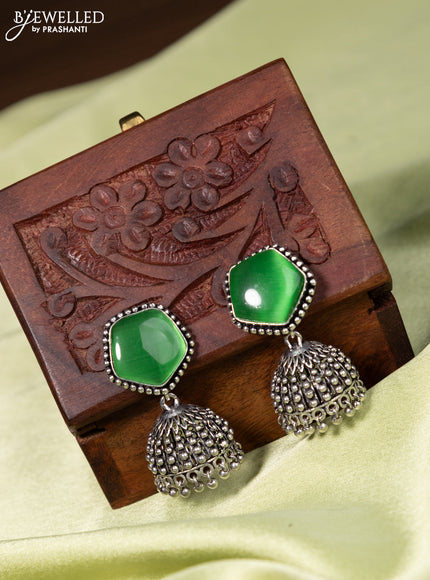 Oxidised jhumka with light green stone and hangings