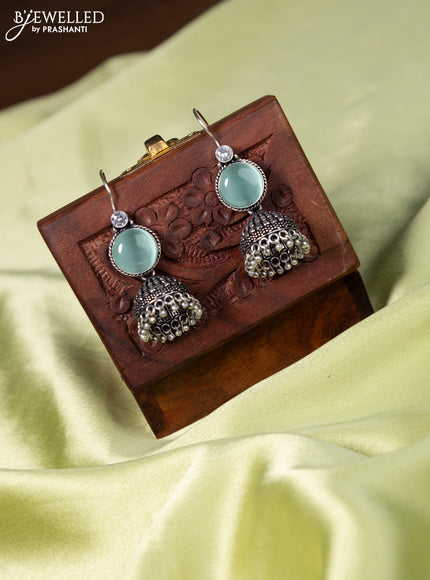 Oxidised hanging jhumka with mint green & cz stones and hangings