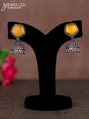 Oxidised jhumka with yellow stones and silver beads hanging