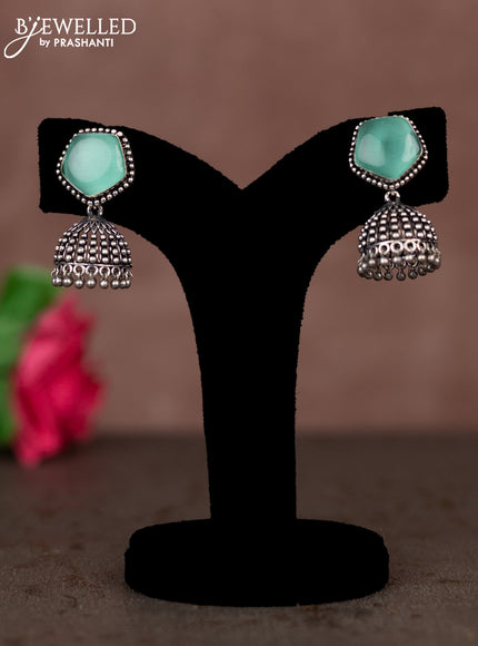Oxidised jhumka with mint green stones and silver beads hanging
