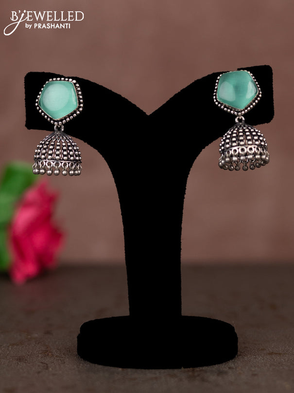 Oxidised jhumka with mint green stones and silver beads hanging
