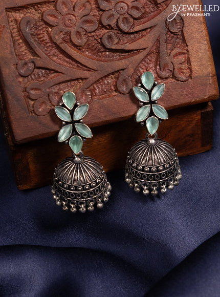 Oxidised jhumka with mint green stones and silver beads hanging