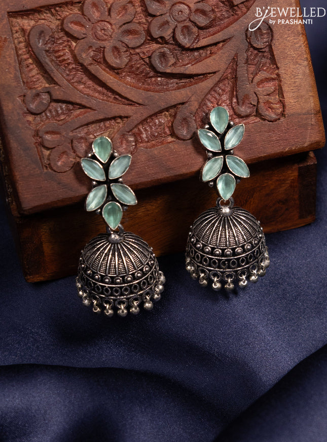 Oxidised jhumka with mint green stones and silver beads hanging