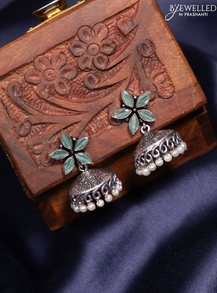 Oxidised jhumka with mint green stones and pearl hangings