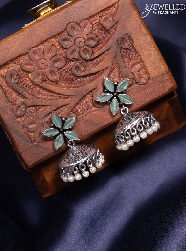 Oxidised jhumka with mint green stones and pearl hangings