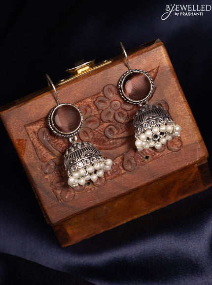 Oxidised hanging type jhumka with rosy brown stones and pearl hangings
