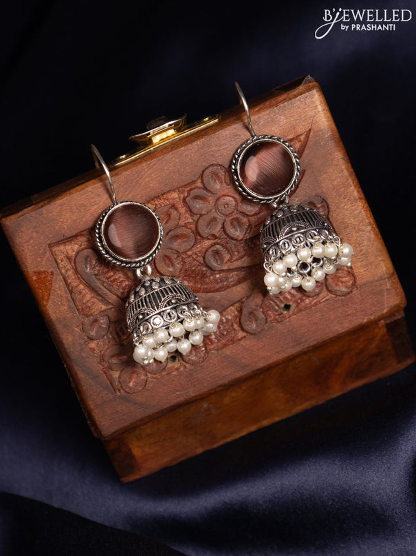 Oxidised hanging type jhumka with rosy brown stones and pearl hangings