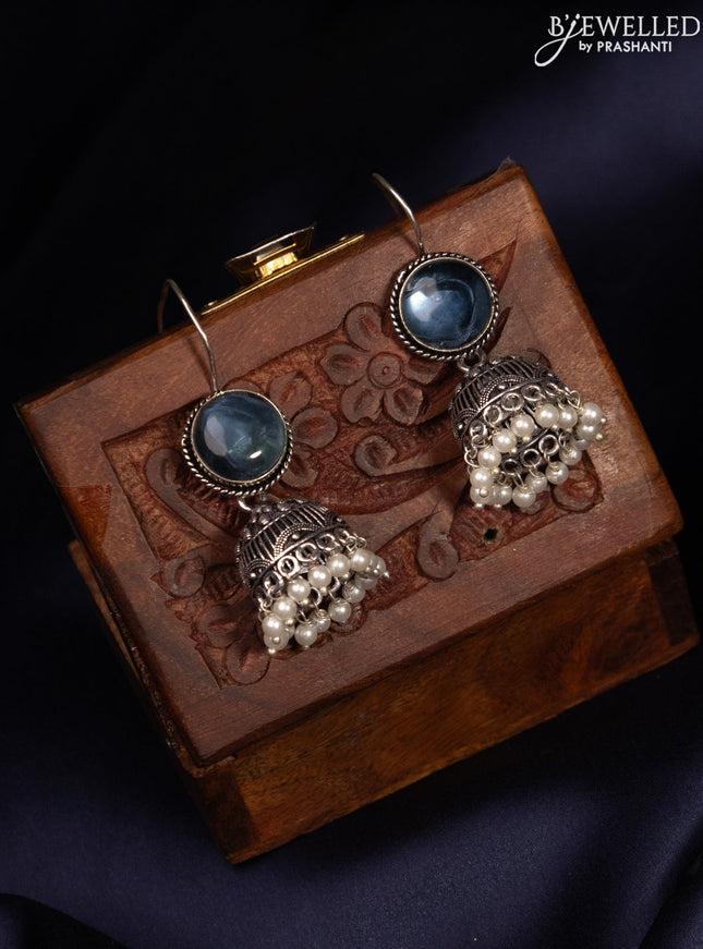 Oxidised hanging type jhumka with sapphire stones and pearl hangings