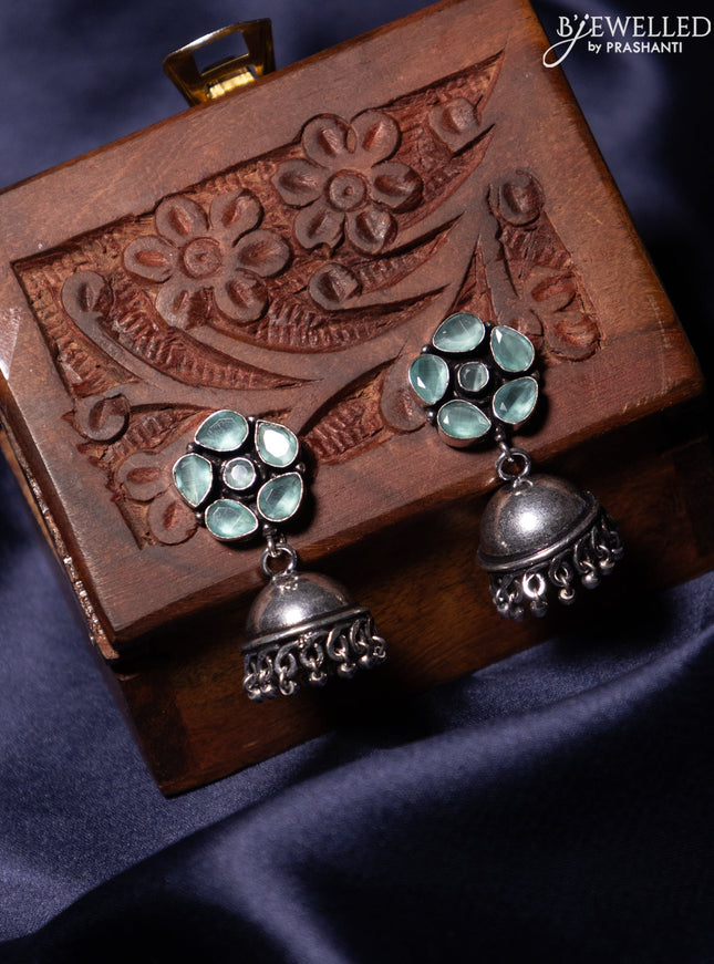 Oxidised jhumka with mint green stones and silver beads hanging