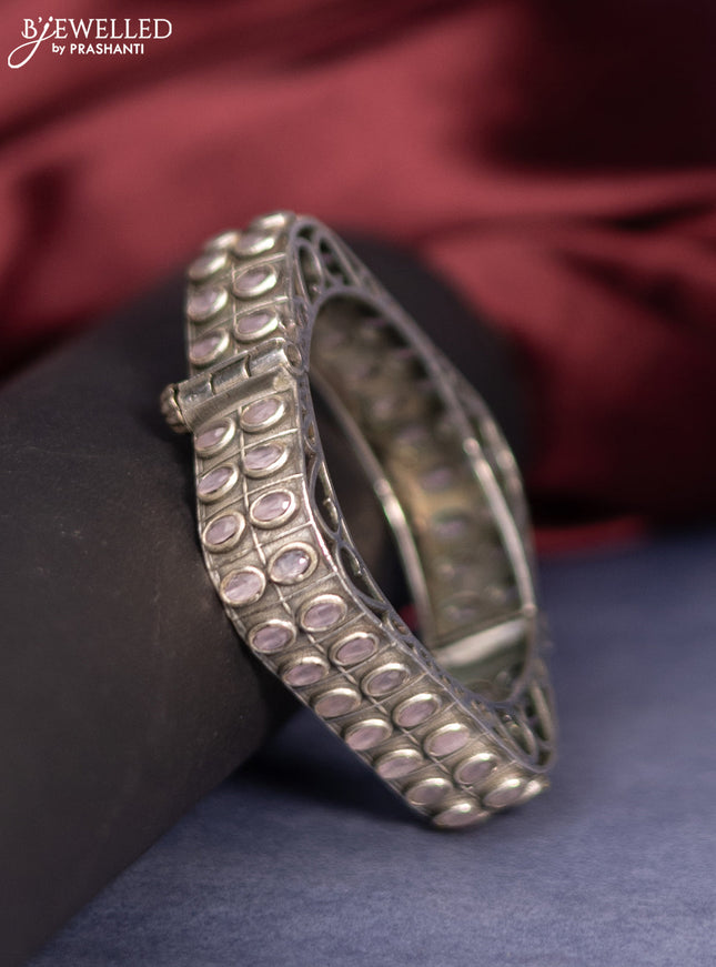 Oxidised screw type bangle with baby pink stones