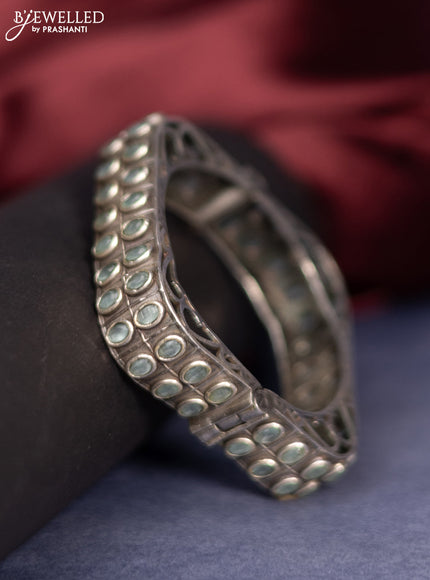 Oxidised screw type bangle with mint green stones