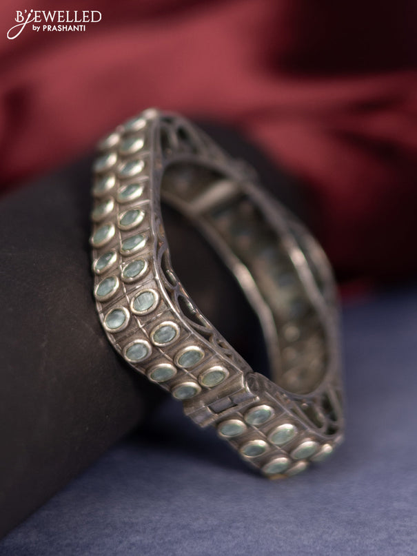 Oxidised screw type bangle with mint green stones