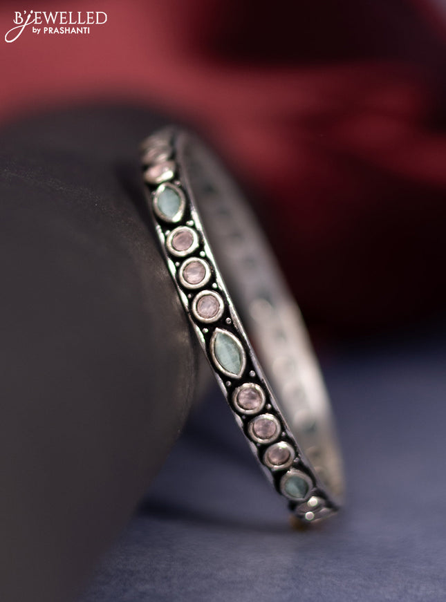 Oxidised bangle with baby pink and mint green stones