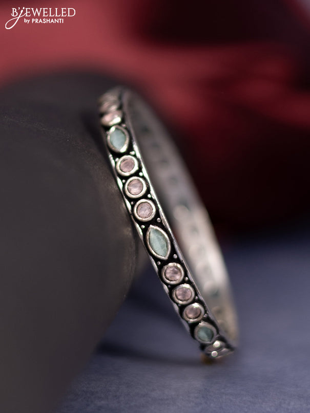 Oxidised bangle with baby pink and mint green stones