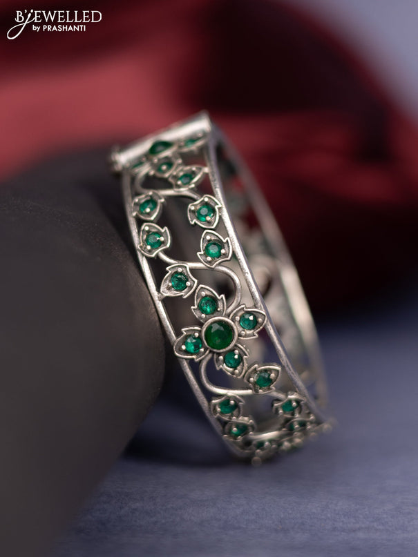 Oxidised screw type bangle with emerald stones