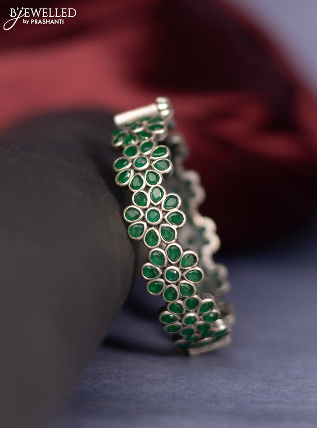 Oxidised screw type bangle floral design with emerald stones