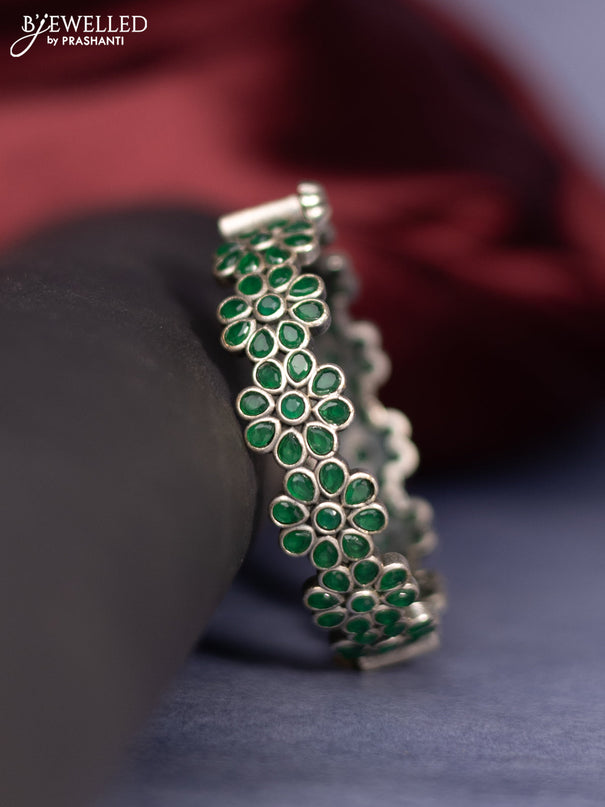 Oxidised screw type bangle floral design with emerald stones