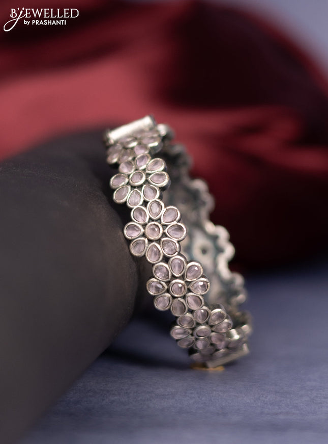 Oxidised screw type bangle floral design with baby pink stones