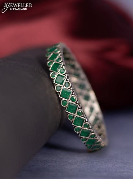 Oxidised bangle with emerald stones
