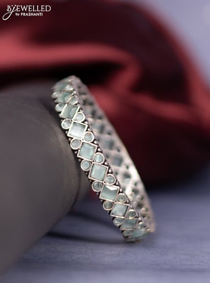 Oxidised bangle with mint green stones