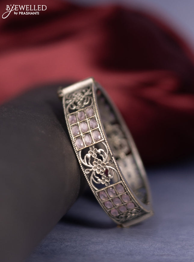Oxidised screw type bangle with baby pink stones