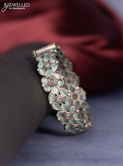 Oxidised screw type bangle with mint green stones
