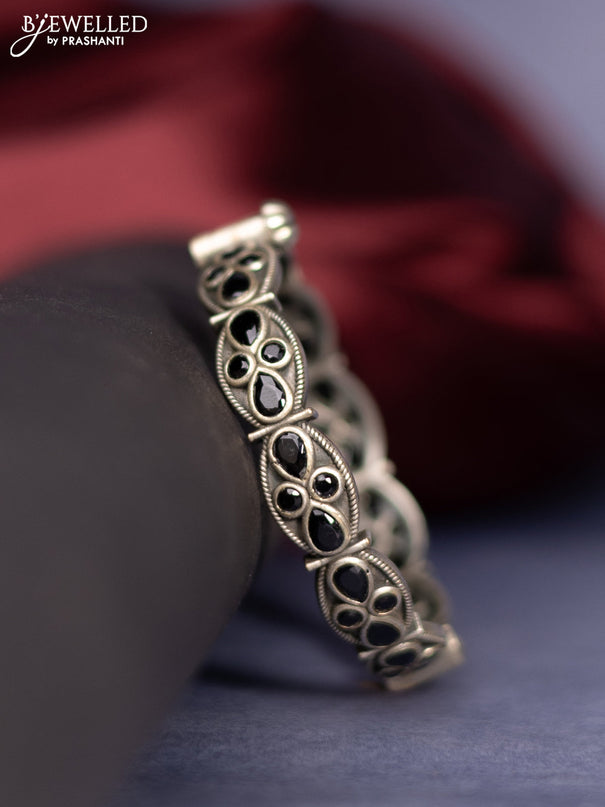 Oxidised screw type bangle with black stones