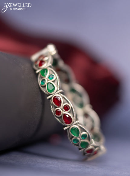 Oxidised screw type bangle with emerald and ruby stones