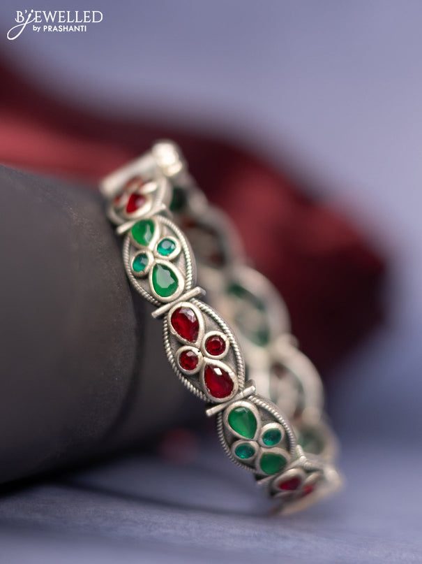 Oxidised screw type bangle with emerald and ruby stones