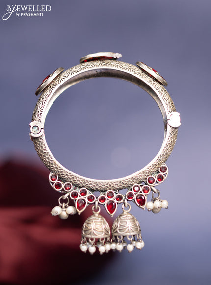 Oxidised screw type bangle with ruby stones and pearl hangings