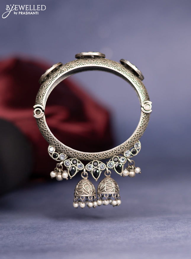 Oxidised screw type bangle with black & white stones and pearl hangings