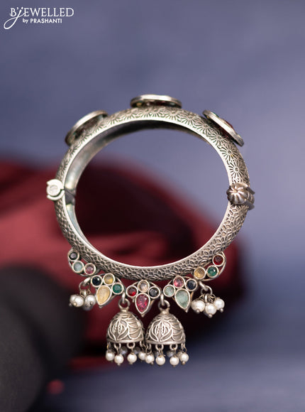 Oxidised screw type bangle with multicolour stones and pearl hangings