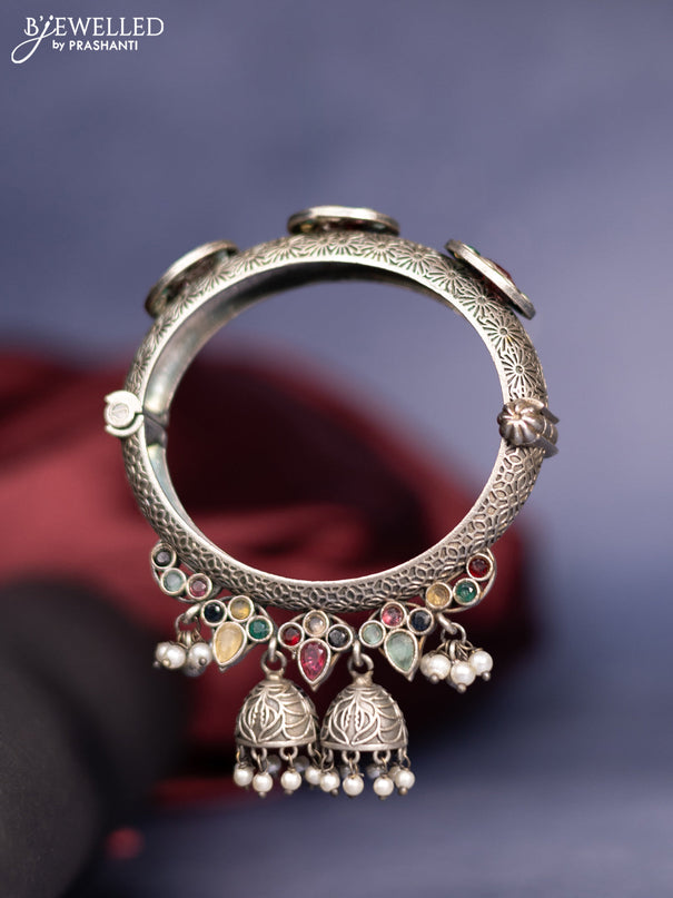 Oxidised screw type bangle with multicolour stones and pearl hangings