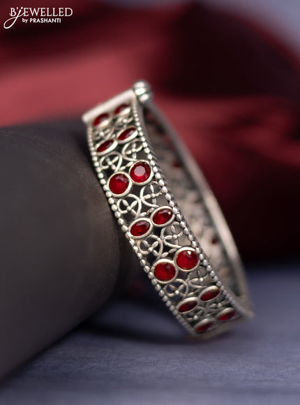 Oxidised screw type bangle with ruby stones