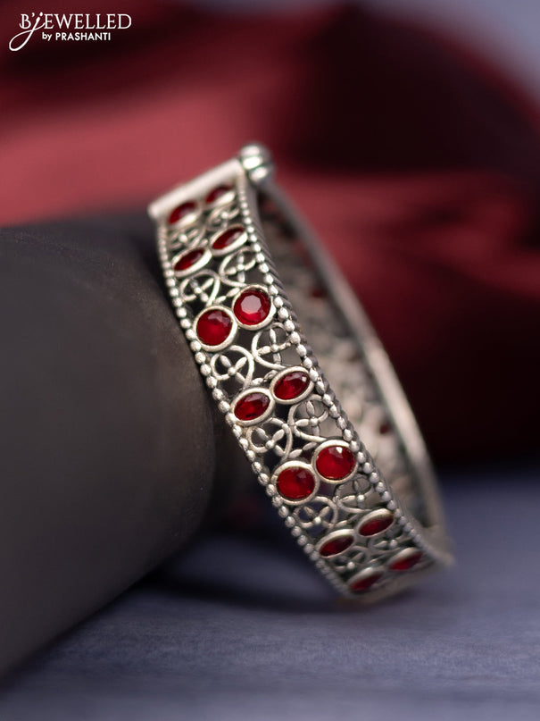 Oxidised screw type bangle with ruby stones