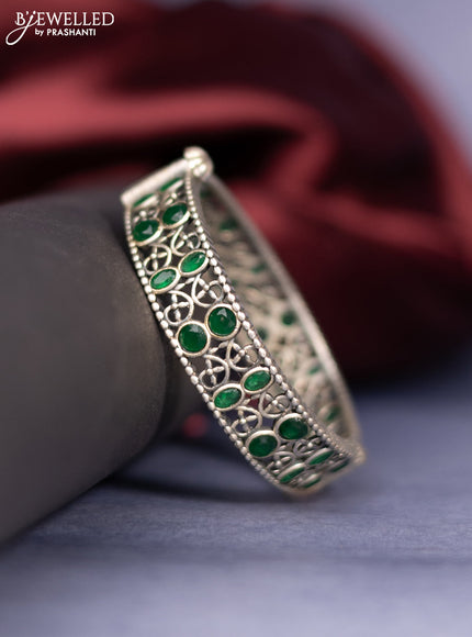 Oxidised screw type bangle with emerald stones