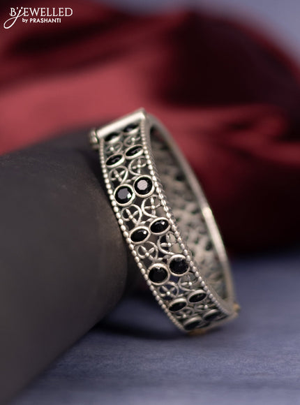 Oxidised screw type bangle with black stones
