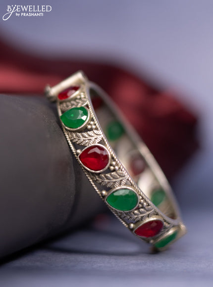 Oxidised screw type bangle with emerald and ruby stones