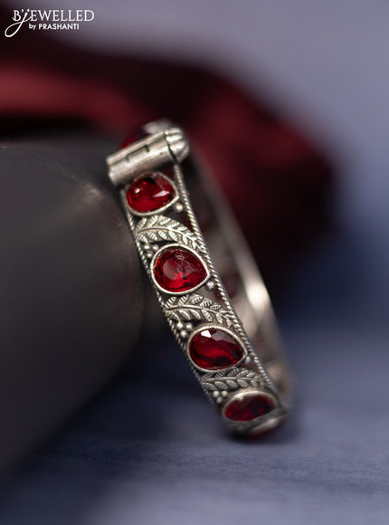 Oxidised screw type bangle with ruby stones