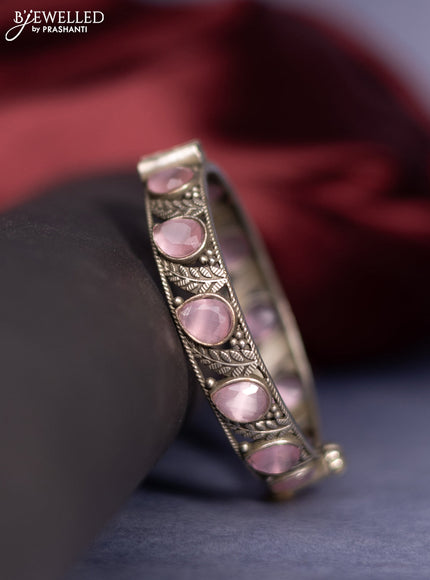 Oxidised screw type bangle with baby pink stones