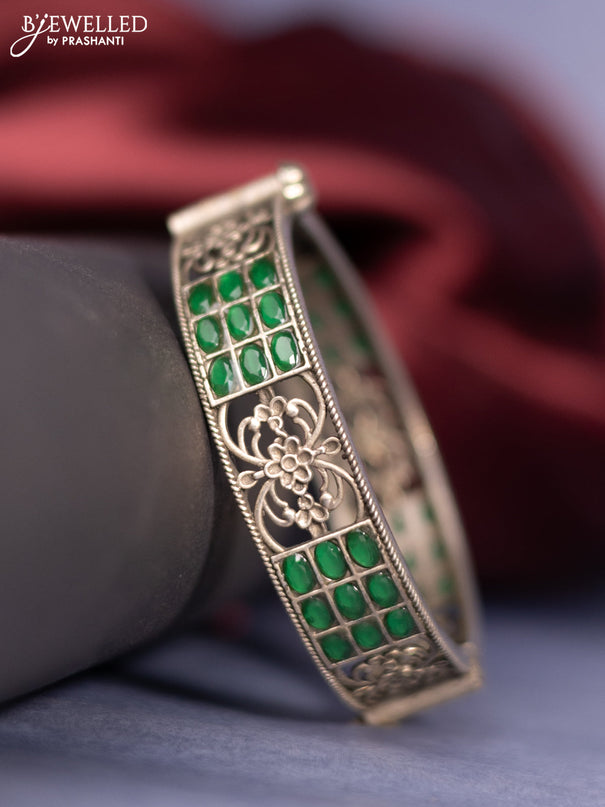 Oxidised screw type bangle with emerald stones