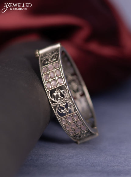 Oxidised screw type bangle with baby pink stones