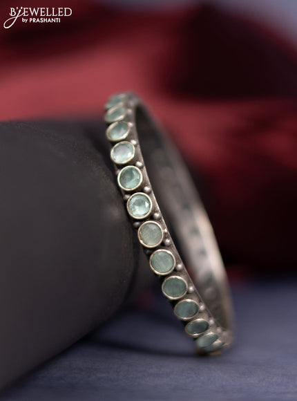 Oxidised bangle with mint green stones