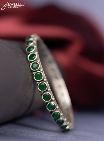 Oxidised bangle with emerald stones