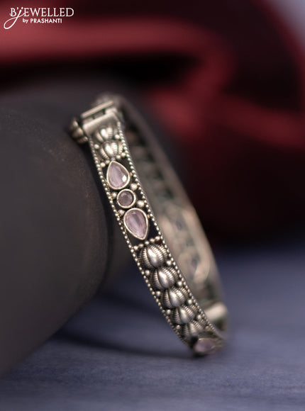 Oxidised screw type bangle with baby pink stones