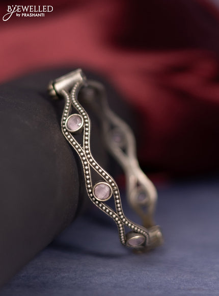 Oxidised screw type bangle with baby pink stones